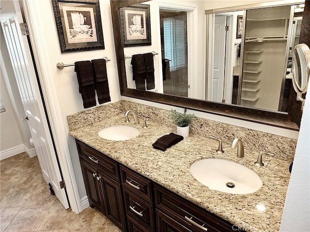 bathroom featuring vanity and tile patterned flooring