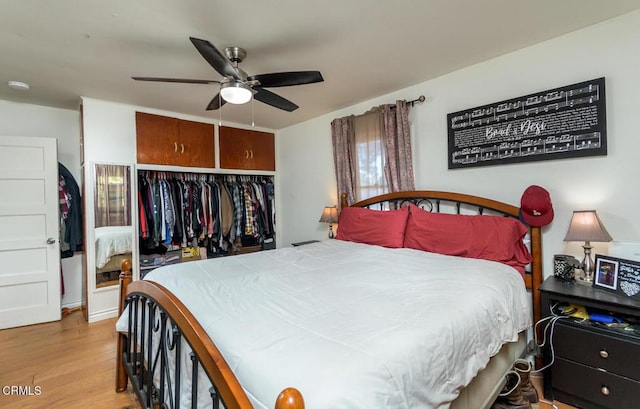 bedroom featuring ceiling fan, a closet, and light hardwood / wood-style flooring