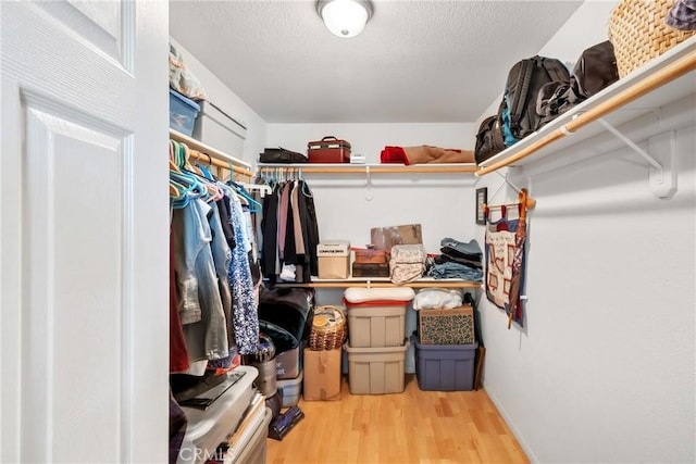 walk in closet featuring hardwood / wood-style floors