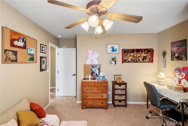 carpeted office featuring ceiling fan