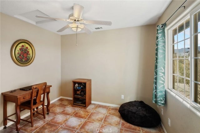 living area with ceiling fan