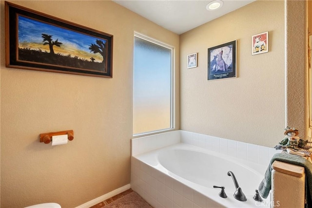 bathroom with tiled bath