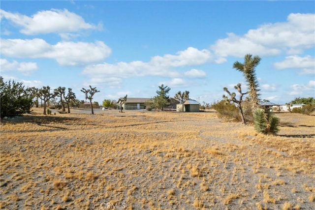 view of yard with a rural view