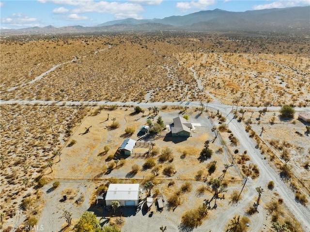 drone / aerial view featuring a mountain view