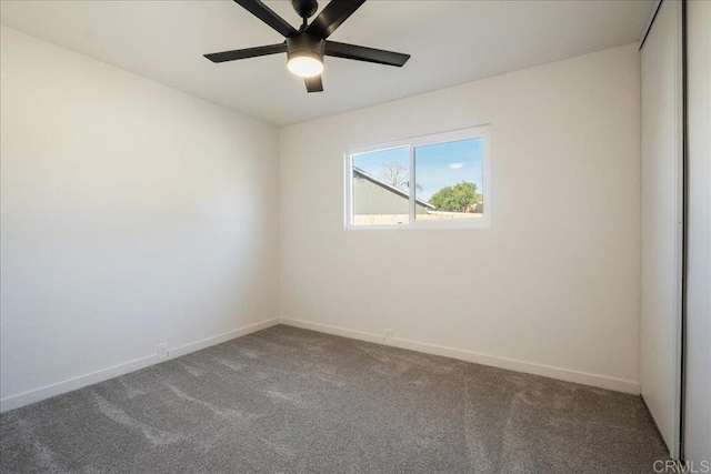 empty room with ceiling fan and carpet floors