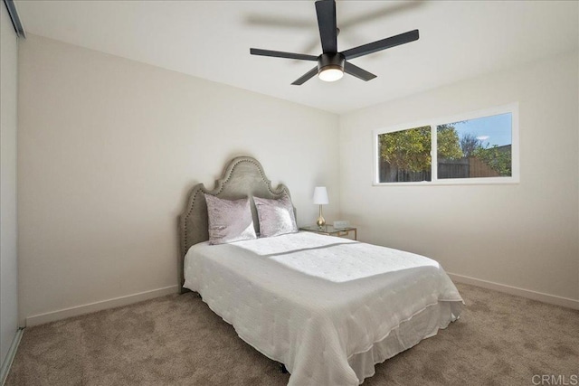 bedroom with ceiling fan and carpet floors