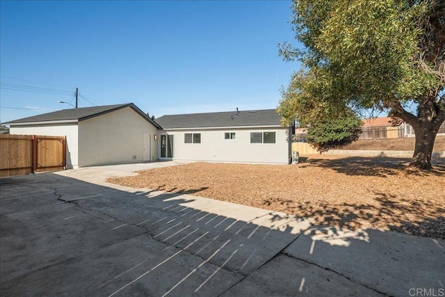 back of house with a patio