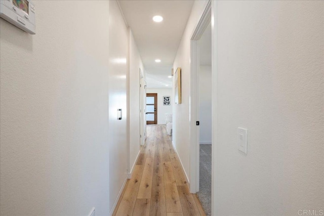 hallway featuring light hardwood / wood-style floors