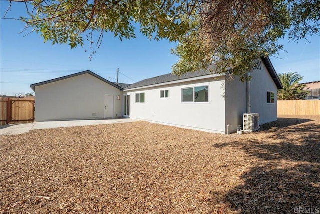 back of house featuring a patio and central air condition unit