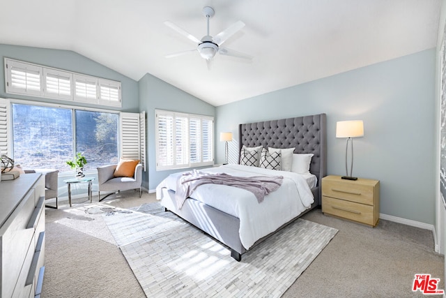 carpeted bedroom featuring vaulted ceiling and ceiling fan