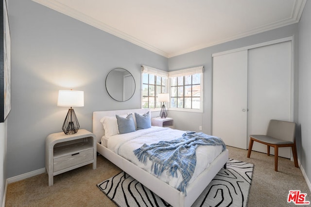 bedroom with light carpet, a closet, and ornamental molding