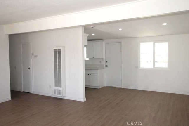 spare room featuring dark hardwood / wood-style flooring