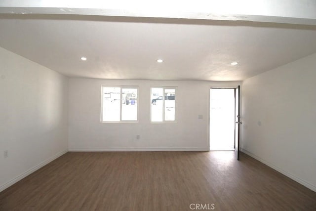 empty room featuring dark hardwood / wood-style floors