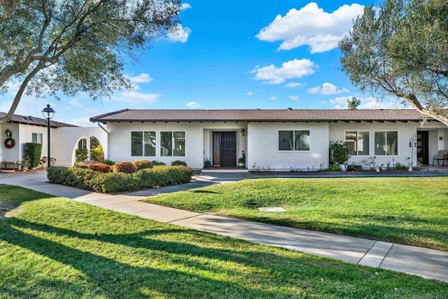 ranch-style house with a front yard