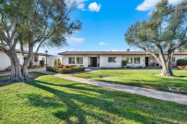 ranch-style home with a front yard