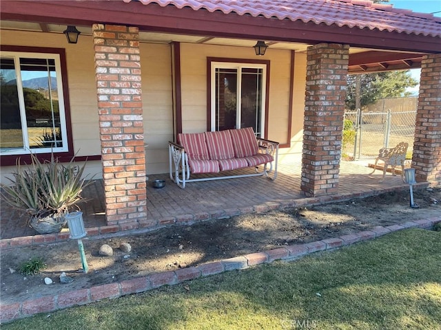 property entrance featuring a patio