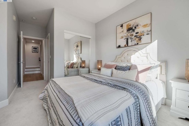 carpeted bedroom with a closet