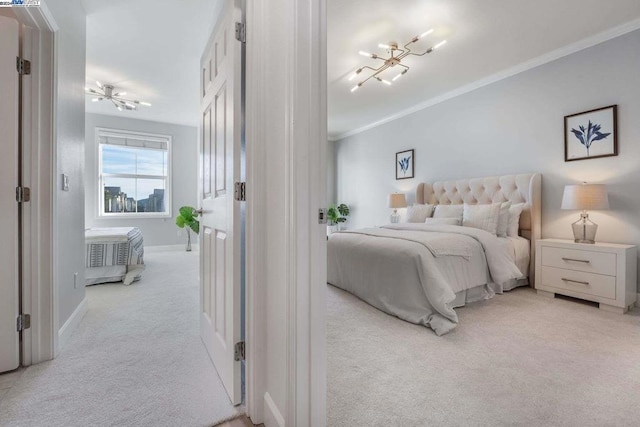 bedroom featuring light carpet and crown molding