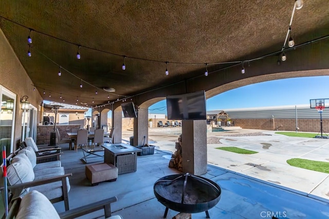 view of patio / terrace with an outdoor fire pit