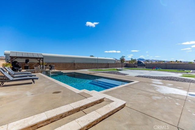 view of pool with a patio area and a gazebo