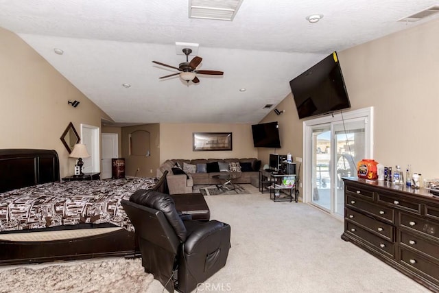 carpeted bedroom with vaulted ceiling, ceiling fan, and access to exterior