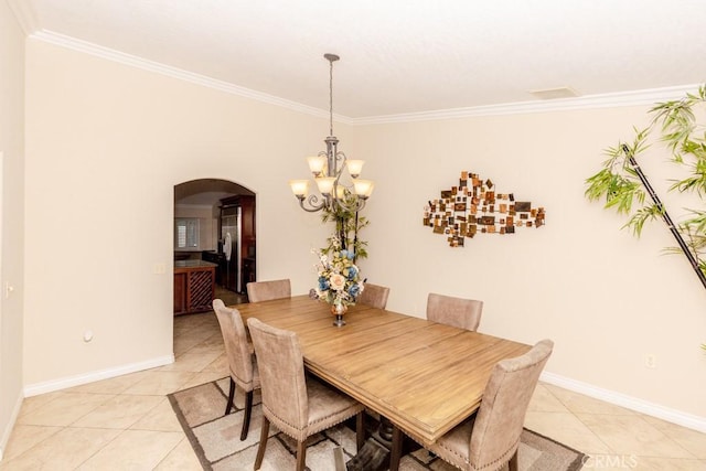 dining area with light tile patterned floors, crown molding, and a notable chandelier