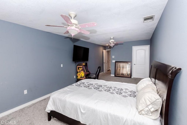 bedroom featuring ceiling fan and carpet flooring