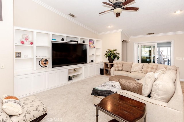 carpeted living room with lofted ceiling, ceiling fan, and ornamental molding