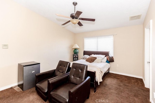 bedroom with ceiling fan and dark colored carpet