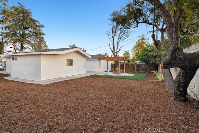 view of yard featuring a patio and a pergola