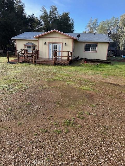 exterior space featuring a deck and a yard