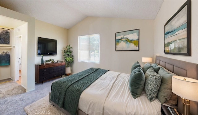 bedroom with light carpet and vaulted ceiling