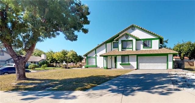 view of front of property with a garage and a front yard