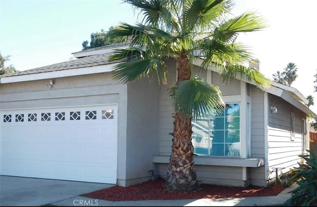 view of property exterior featuring a garage