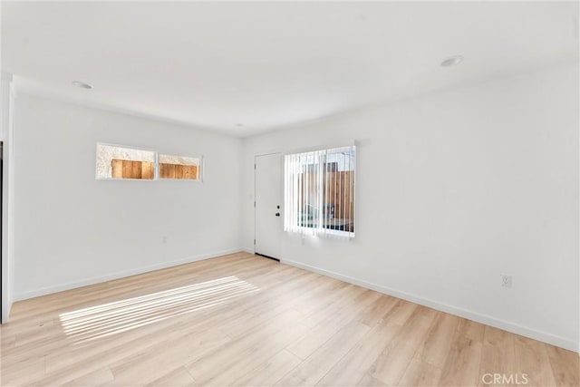 unfurnished room featuring light hardwood / wood-style floors