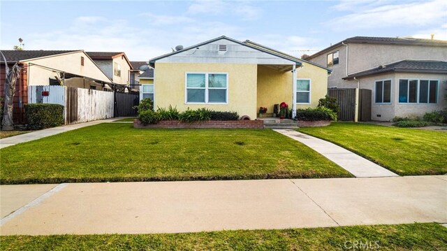 bungalow-style house featuring a front yard