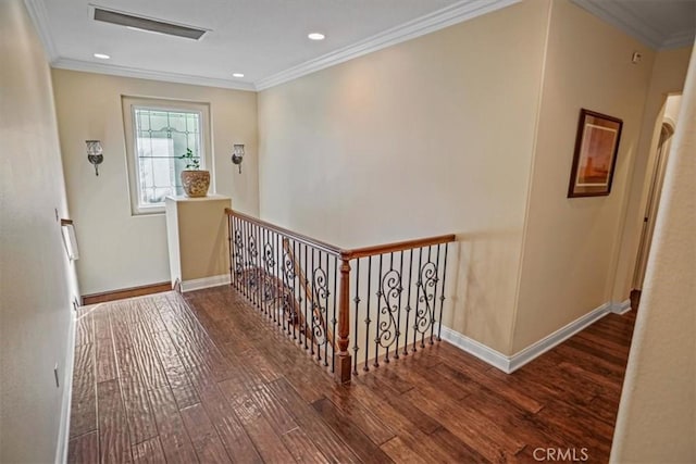 hallway with wood-type flooring and ornamental molding