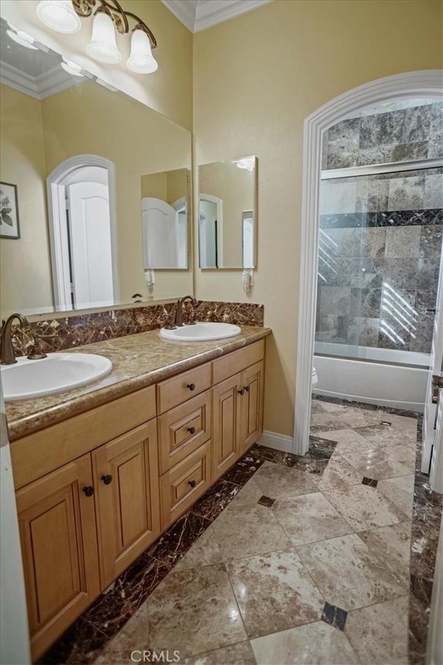 full bathroom with shower / bath combination with glass door, toilet, crown molding, and vanity