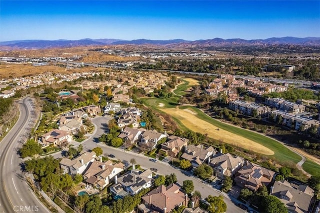 birds eye view of property with a mountain view