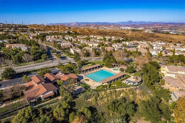 birds eye view of property featuring a mountain view