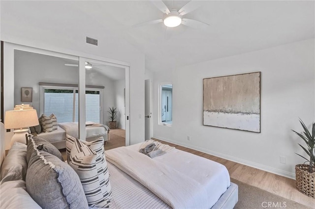 bedroom featuring ceiling fan, vaulted ceiling, and light hardwood / wood-style floors