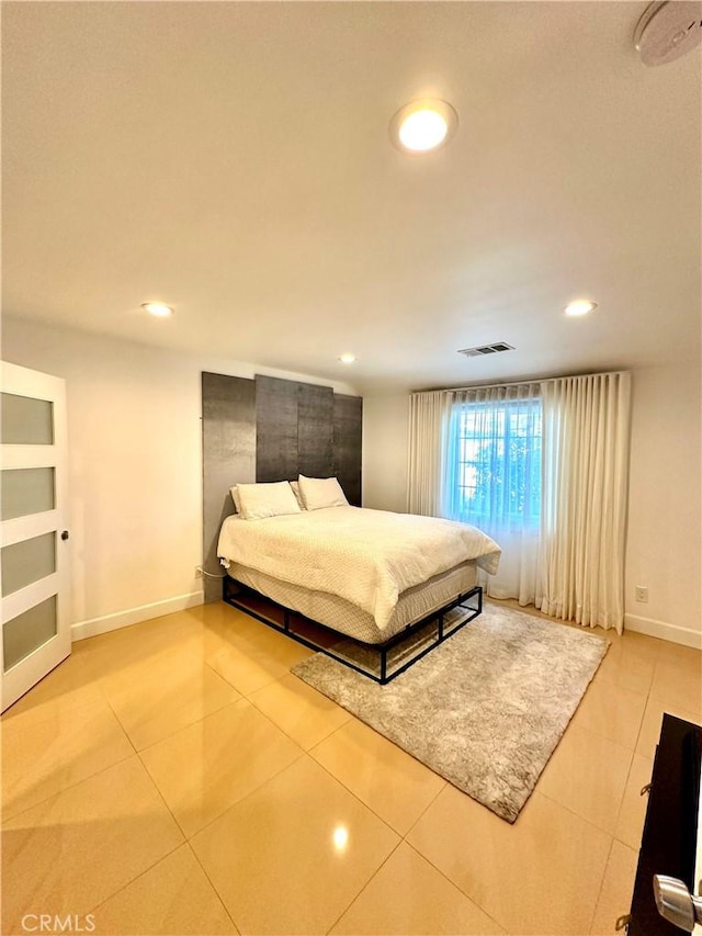 bedroom featuring tile patterned flooring