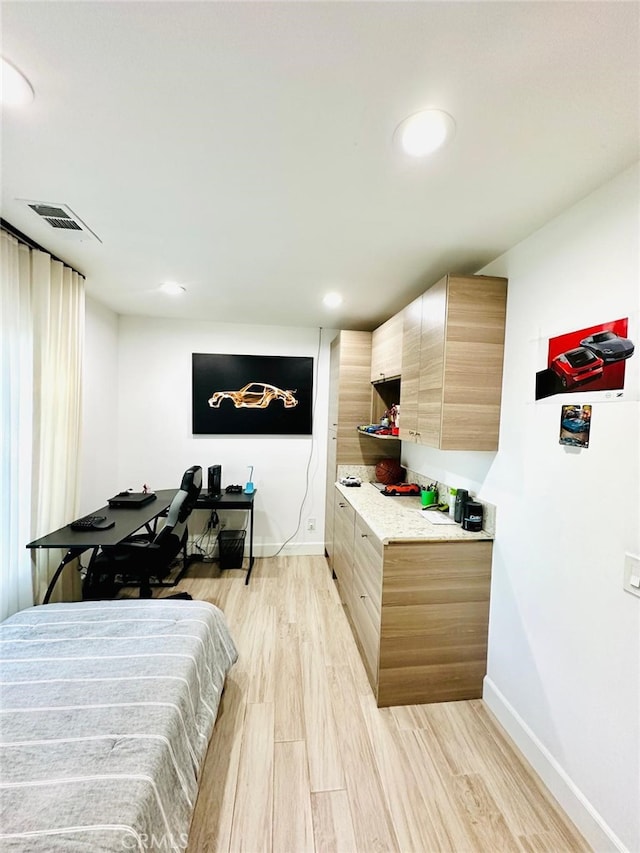 bedroom with light hardwood / wood-style flooring