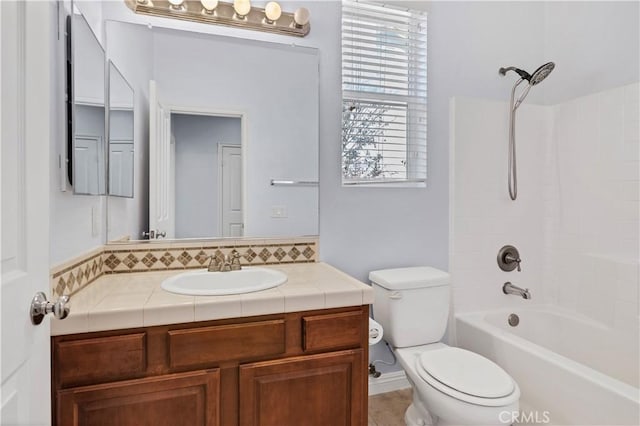 bathroom featuring backsplash, shower / bathing tub combination, toilet, and vanity