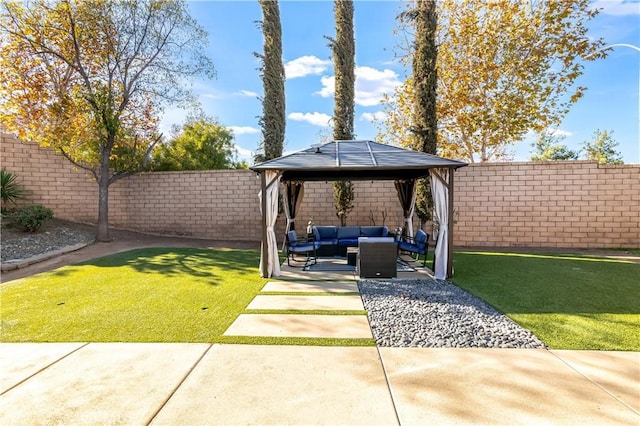 exterior space with outdoor lounge area, a gazebo, a fenced backyard, and a patio area