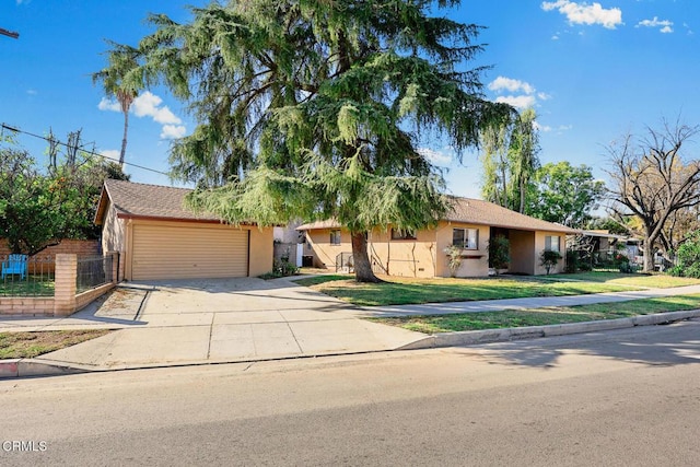 view of front of house with a garage and a front yard