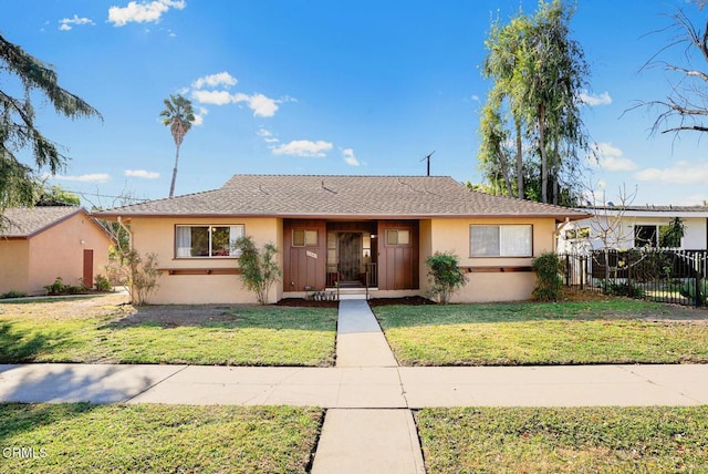 ranch-style home with a front yard