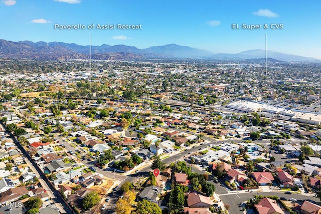 birds eye view of property with a mountain view