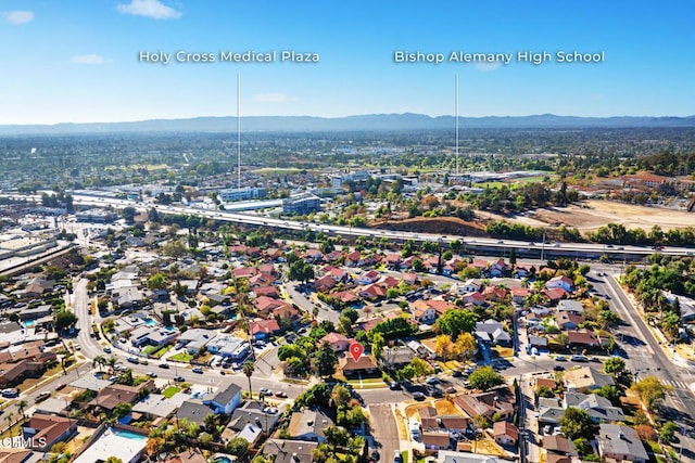 birds eye view of property with a mountain view