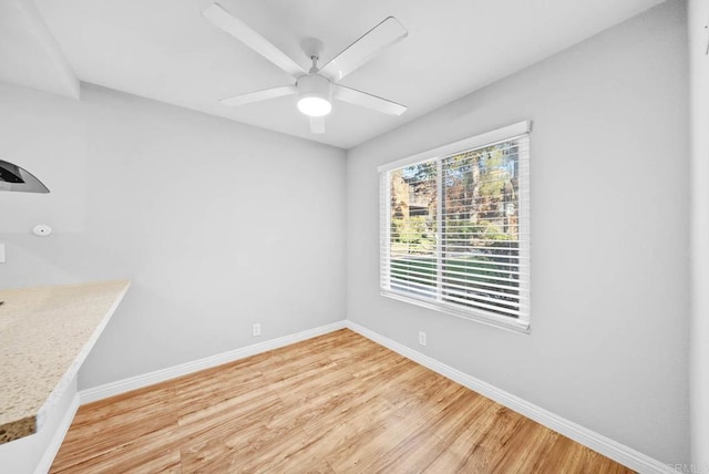 unfurnished dining area with hardwood / wood-style flooring and ceiling fan